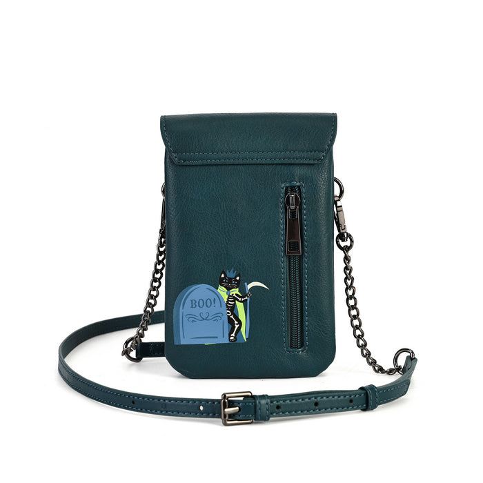 A dark teal green faux-leather crossbody phone bag with a Halloween-themed graphic of a cat standing on a tombstone that says 'BOO!'. The bag features a vertical zippered pocket, a matching shoulder strap with a silver buckle, and a metal chain strap.