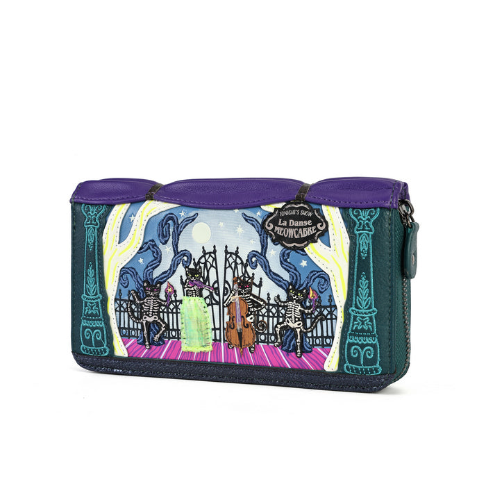 A Disney La Belle Reclusa zip-around clutch wallet featuring a colorful gothic illustration of skeleton dancers, purple leather trim, and a dark teal body, shown on a plain white background.