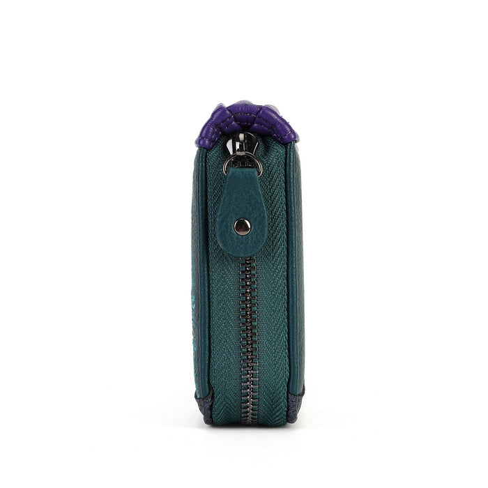 A teal blue textured leather zip-around wallet shown from the side profile on a white background, featuring a purple braided cord detail at the top and a silver-tone metal snap button.