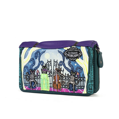 A purple and teal zip-around pouch featuring a colorful graphic print of 'La Danse des Concaris' with skeleton figures and a gate, shown on a plain white background.