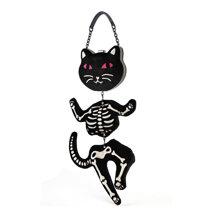 A black cat-shaped clutch bag with a skeleton design, featuring a black cat head with pink eyes, a skeleton torso, and a skeleton leg dangling below, complete with a black chain strap.
