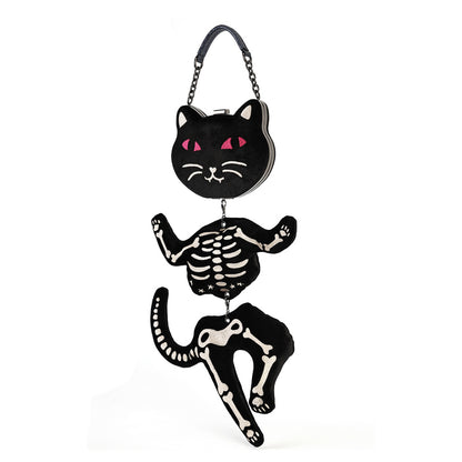A black cat-shaped clutch bag with a skeleton design, featuring a black cat head with pink eyes, a skeleton torso, and a skeleton leg dangling below, complete with a black chain strap.