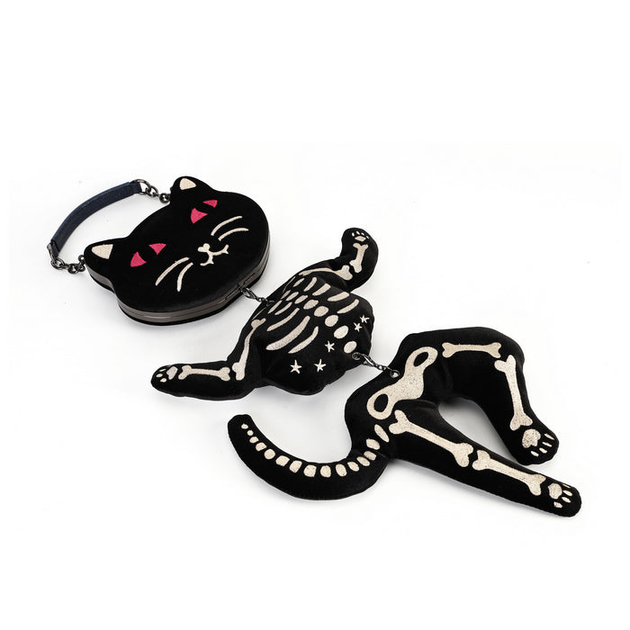 A black gothic-style plush accessory set featuring a cat-shaped pouch with pink details and a skeleton cat figure with matching skeleton chain details, shown on a plain white background.