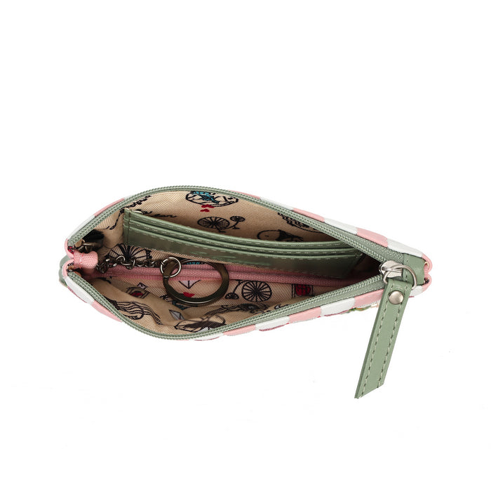 An open zippered coin purse with a pink and white patterned exterior, a sage green interior lining, and a bicycle print on the inside flap, shown on a white background.