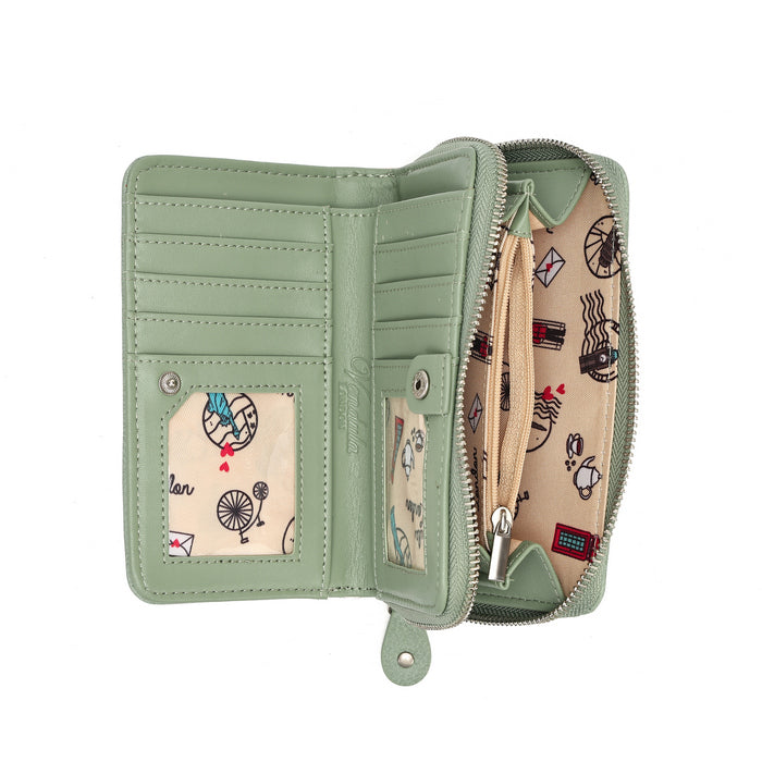 An open sage green zip-around wallet shown from the inside, featuring multiple card slots, a patterned ID window, and a beige interior lining with small colorful travel-themed illustrations.
