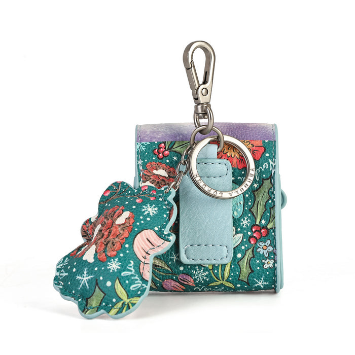 A small fabric keychain pouch with a floral and holly pattern in teal, green, red, and purple, featuring a light blue leather tab and a silver clasp. A matching decorative tag hangs from the key ring.