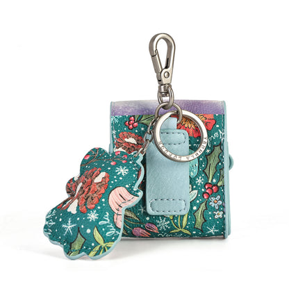 A small fabric keychain pouch with a floral and holly pattern in teal, green, red, and purple, featuring a light blue leather tab and a silver clasp. A matching decorative tag hangs from the key ring.