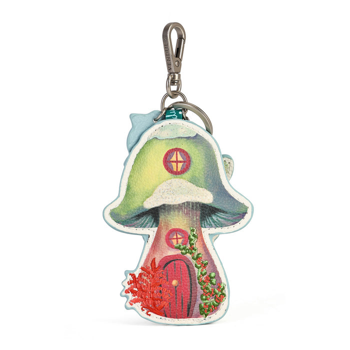 A small decorative charm made for attaching to keys or bags. Printed and embossed vegan leather features snowy toadstool houses, fairy doors, winter trees, rabbits and snowflakes, finished with a secure clip and split ring.