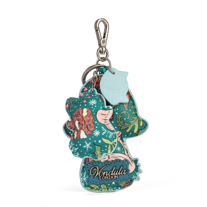 A small decorative charm made for attaching to keys or bags. Printed and embossed vegan leather features snowy toadstool houses, fairy doors, winter trees, rabbits and snowflakes, finished with a secure clip and split ring.