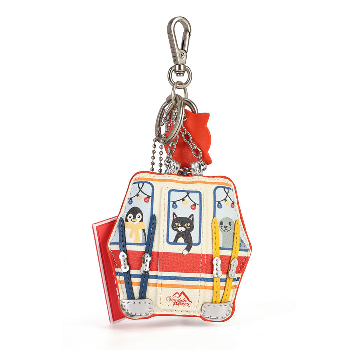 A small tote-style keychain bag with a trolley-inspired design, featuring illustrated animal characters in window frames, colorful hanging straps, silver hardware, and a red cat-shaped charm on a white background.