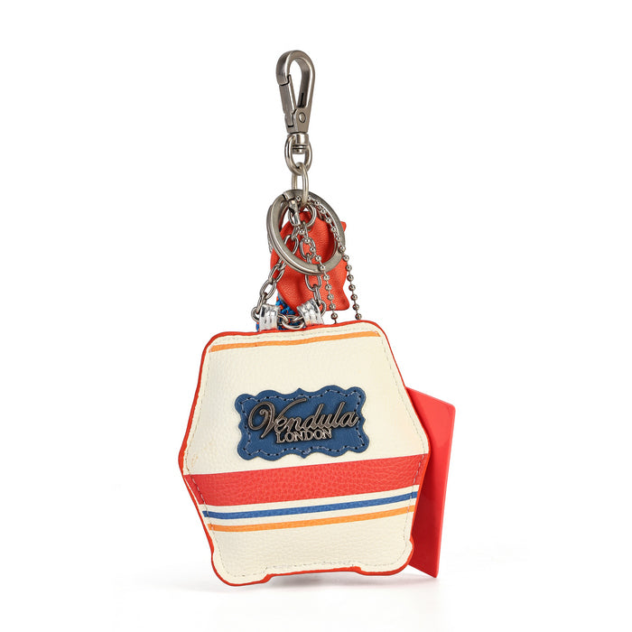 A small hexagonal keychain bag with a cream-colored faux leather body, red and blue stripes, a blue 'Kendulla' logo patch, and a silver metal clasp on a white background.