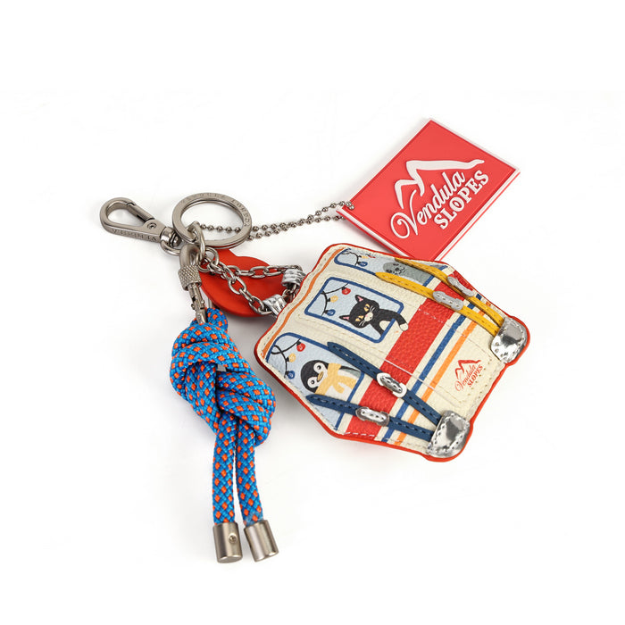 A Vondel Slaters keychain featuring a colorful printed luggage charm, a blue and orange braided rope knotted ornament, and a red hanging tag with the Vondel Slaters logo, set against a plain white background.