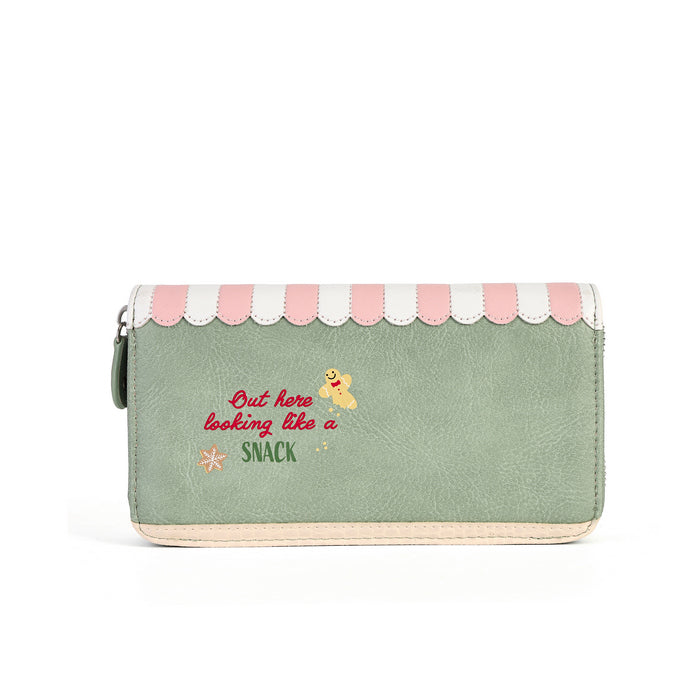 A mint green faux leather zip-around wallet with a pink and white scalloped awning design on top, featuring the text 'Out here looking like a snack' in red and yellow embroidered lettering.
