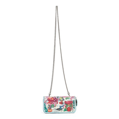 A small rectangular shoulder bag with a silver chain strap, featuring a colorful whimsical illustration of a fairy tale forest with mushrooms, a bluebird, and a fox on a white background.