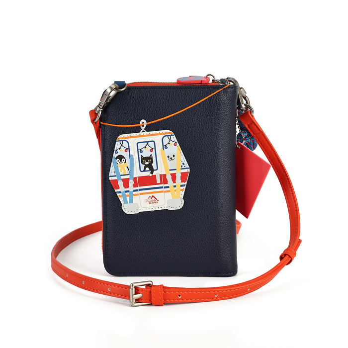 compact organiser with a front phone pocket, ziparound compartment, multiple internal pockets, mirror and detachable crossbody strap. Embroidery and appliqué add texture to artwork featuring snowy peaks, chalet scenes, gondolas and ski-route details.