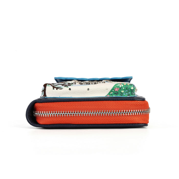 compact organiser with a front phone pocket, ziparound compartment, multiple internal pockets, mirror and detachable crossbody strap. Embroidery and appliqué add texture to artwork featuring snowy peaks, chalet scenes, gondolas and ski-route details.