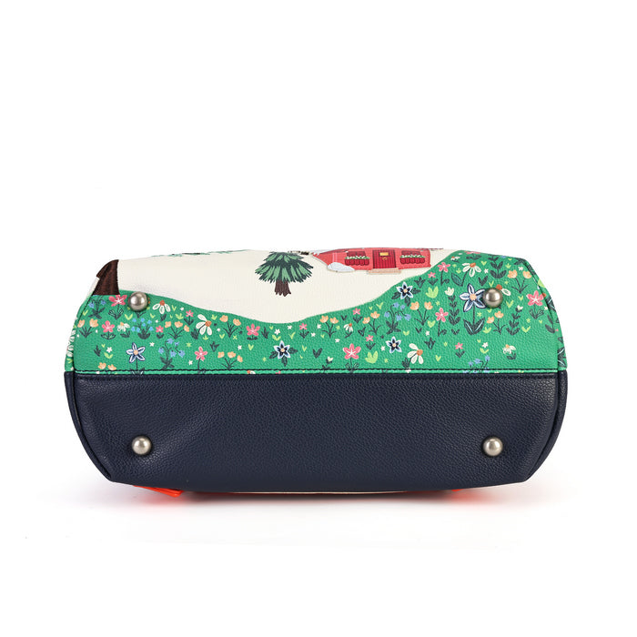 A small handbag with a dark navy blue pebbled leather base and a green floral fabric top panel featuring a small tree illustration and a red brand label.