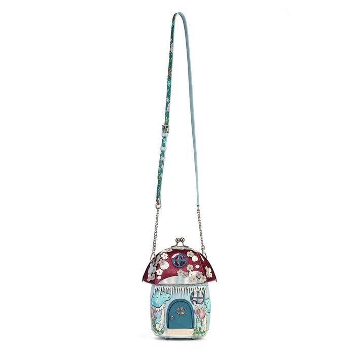 A mushroom-shaped crossbody bag with a long strap, featuring a burgundy cap with white floral patterns, a blue flower-shaped body, and silver-tone chain details, shown on a plain white background.