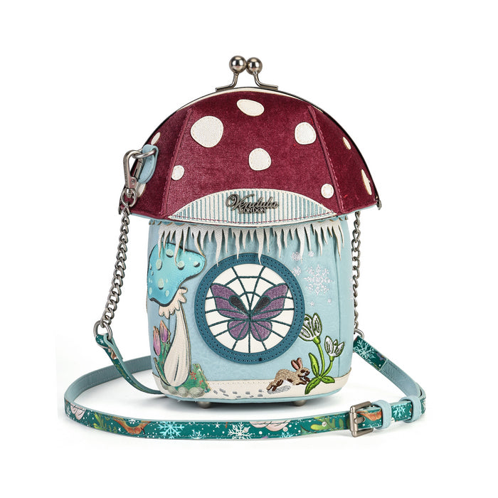 A novelty house-shaped crossbody with a secure clasp, detachable strap and compact main compartment. Printed and embossed vegan leather turns snowy toadstool houses, fairy doors, winter trees, rabbits and snowflakes into a playful winter woodland design.
