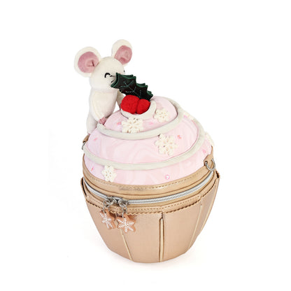 A festive Christmas-themed cupcake purse featuring a light pink frosting top with white snowflake embellishments, a red berry accent, and a small white mouse plush decoration, set against a plain white background.