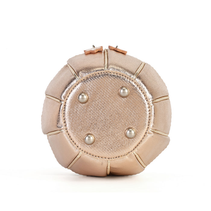 A round, dome-shaped metallic champagne clutch bag with a textured center panel, four silver pearl studs, and a top zipper closure, shown on a plain white background.