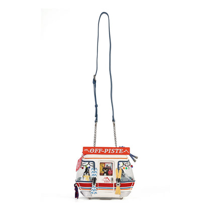 A small crossbody bag with a blue strap and a colorful printed front panel featuring a red 'OFF-PISTE' banner and illustrated details, shown on a plain white background.