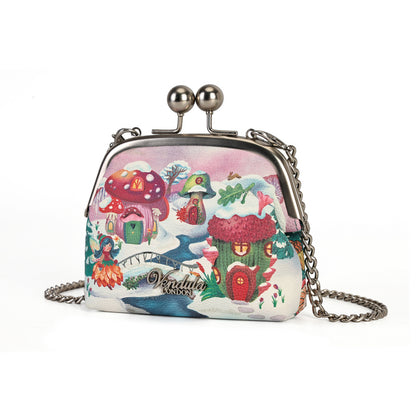 A compact clip-frame purse that can also be worn as a mini crossbody with the detachable chain strap. Embroidery, appliqué and internal card slots combine with snowy toadstool houses, fairy doors, winter trees, rabbits and snowflakes in a small but versatile design.
