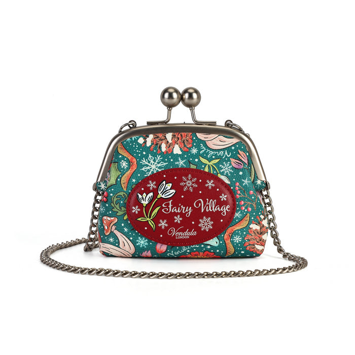 A compact clip-frame purse that can also be worn as a mini crossbody with the detachable chain strap. Embroidery, appliqué and internal card slots combine with snowy toadstool houses, fairy doors, winter trees, rabbits and snowflakes in a small but versatile design.