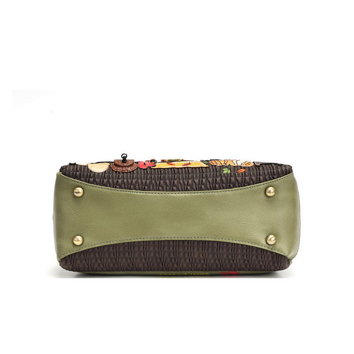 A structured clutch bag with an olive green leather front panel, dark brown textured fabric sides, and gold-tone metal studs, shown against a plain white background.