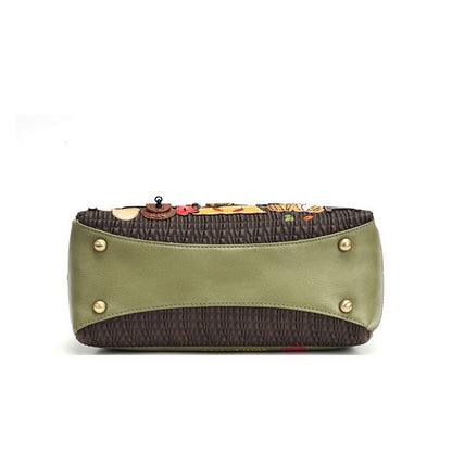 A structured clutch bag with an olive green leather front panel, dark brown textured fabric sides, and gold-tone metal studs, shown against a plain white background.