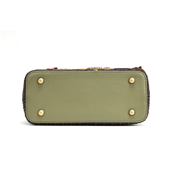 The bottom view of a rectangular handbag or clutch in olive green leather with four gold-tone metal studs on the base and a dark fringed edge, shown on a white background.