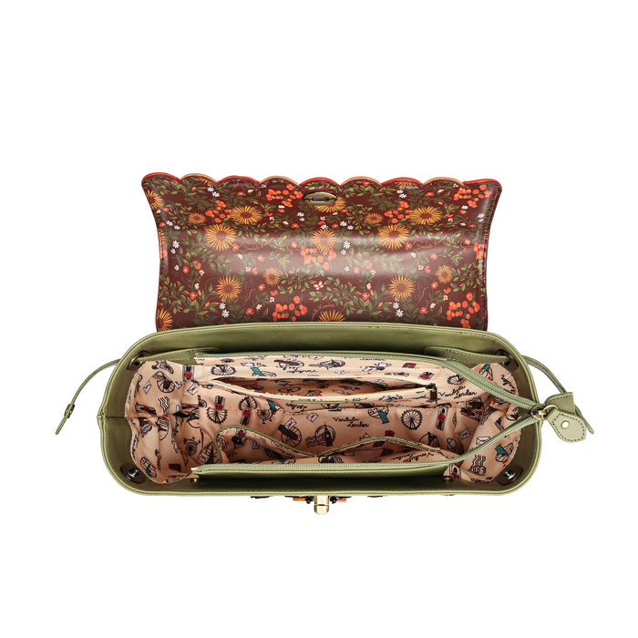 An open olive green clutch bag with a floral patterned exterior and a beige patterned interior organizer pouch.