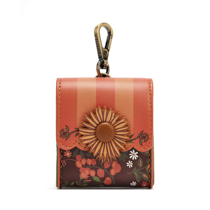A small leather key pouch with a floral and striped design, featuring a large embossed sunflower on the front and a brass key clasp at the top, shown against a plain white background.