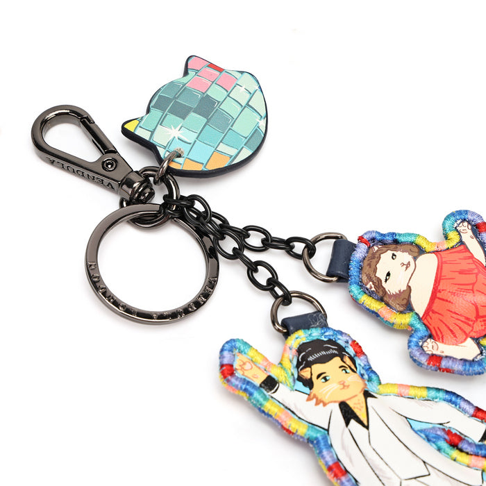 A colorful keychain featuring a cat-shaped disco ball charm, a black metal clasp and chain, and two illustrated character charms on a plain white background.