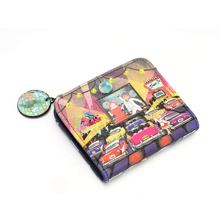 A small bi-fold wallet with a colorful illustrated print featuring vintage cars, a disco ball, and neon signs, shown on a plain white background with a matching round disco ball charm attached.