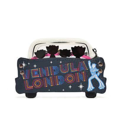 A novelty coin purse designed to look like a black London cab, featuring 'VENDIDA LONDON' in colorful embroidered-style lettering, a blue neon sign of a person, and black cat silhouettes peeking out from behind a clear window.