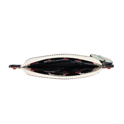 An open zippered pouch or coin purse with a cream-colored exterior and a dark, patterned interior featuring red and black details, shown against a plain white background.