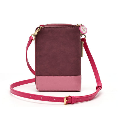 A small rectangular crossbody phone bag with a dark burgundy top section, a light pink bottom panel, and a bright pink adjustable strap with gold-tone hardware, shown on a white background.