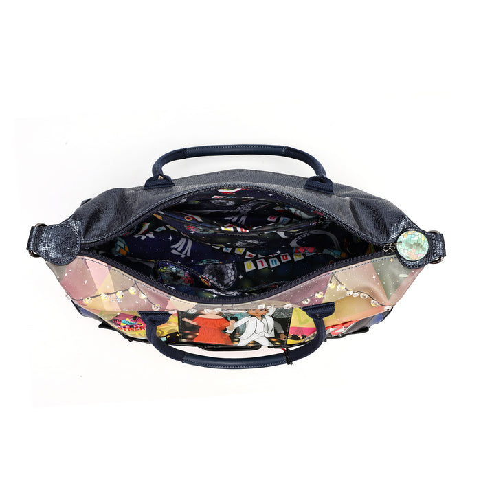 An open black duffel bag with a colorful illustrated print on the bottom half, showing a patterned interior lining, black handles, and a small round patch on the side, photographed on a white background.