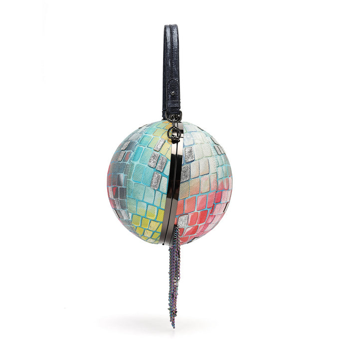 A spherical clutch bag covered in colorful mosaic tile patterns, featuring a black leather top handle and a dangling beaded tassel, set against a plain white background.