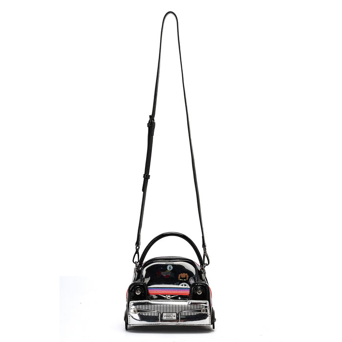 A black faux leather shoulder bag designed in the shape of a classic car, featuring a long black shoulder strap and a chrome silver front grille.