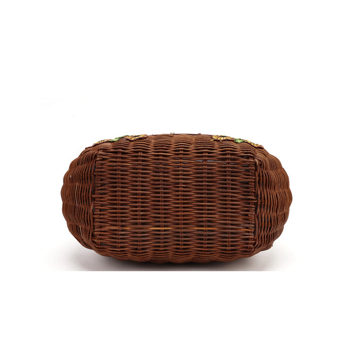 A brown woven wicker clutch bag with a rounded rectangular shape, shown from the bottom on a white background.