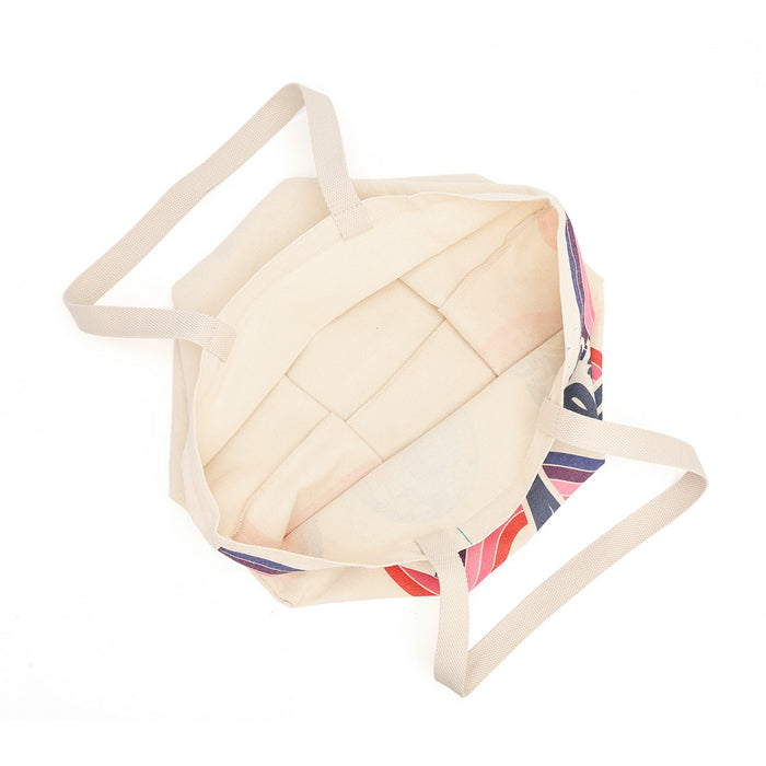 An open canvas tote bag with a cream-colored interior and a multicolor patterned exterior featuring red, blue, and white stripes, shown on a plain white background.