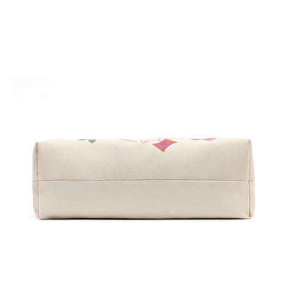 A cream-colored canvas pouch with a subtle pink and green floral pattern on the top, shown against a plain white background.