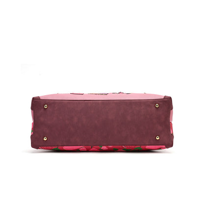 A roomy holdall for travel, busy days or carrying extra essentials, with twin handles and an adjustable detachable strap. The sewing-themed artwork combines cotton reels, ribbons, scissors and rose motifs with Pink Ribbon details, finished with hand-stitched accents.

