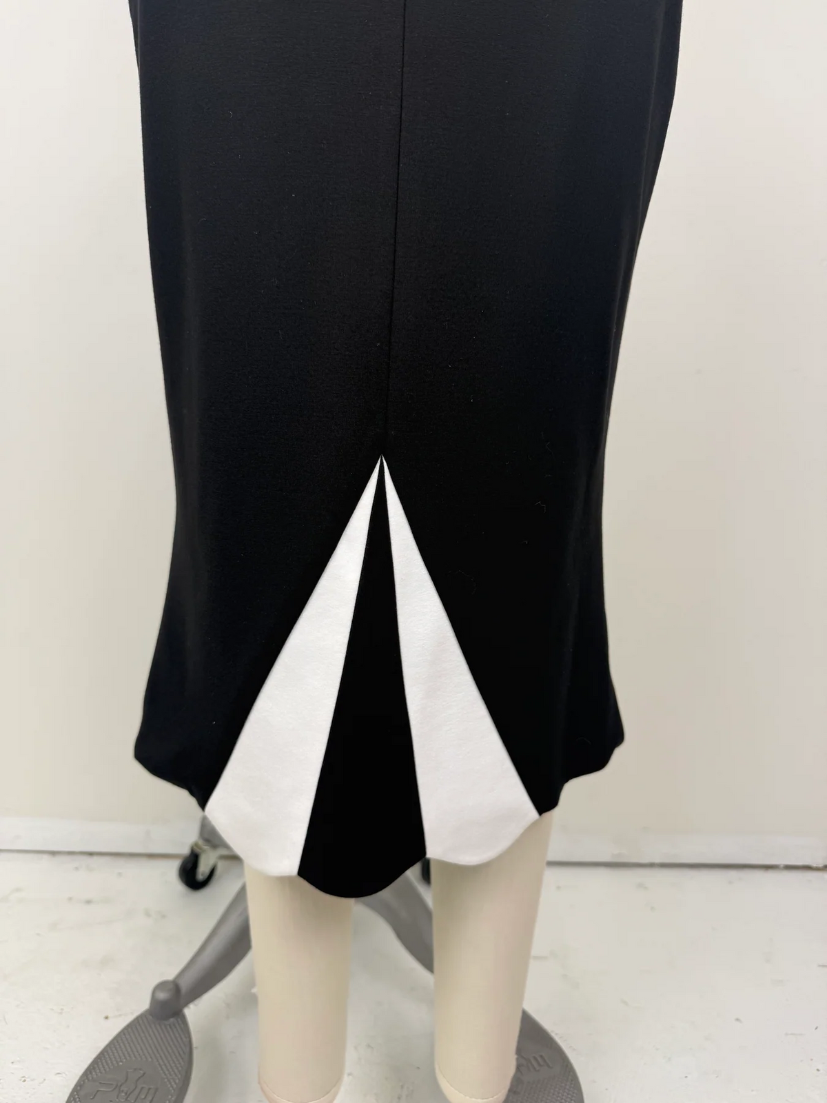 The Love Me Not Skirt is designed with a sleek, high waisted silhouette that flatters the figure while keeping the look polished and refined.