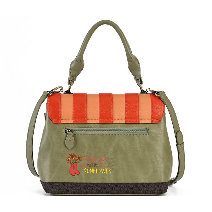 An olive green faux leather handbag with a striped flap in orange, red, and peach, featuring a front zip pocket, top handles, and a decorative embroidered sunflower patch.