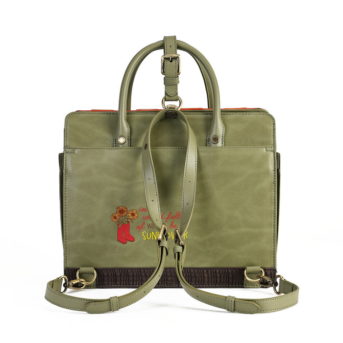An olive green leather tote bag with dual top handles and a detachable shoulder strap, featuring a small embroidered design on the front pocket with red text and a red boot illustration.