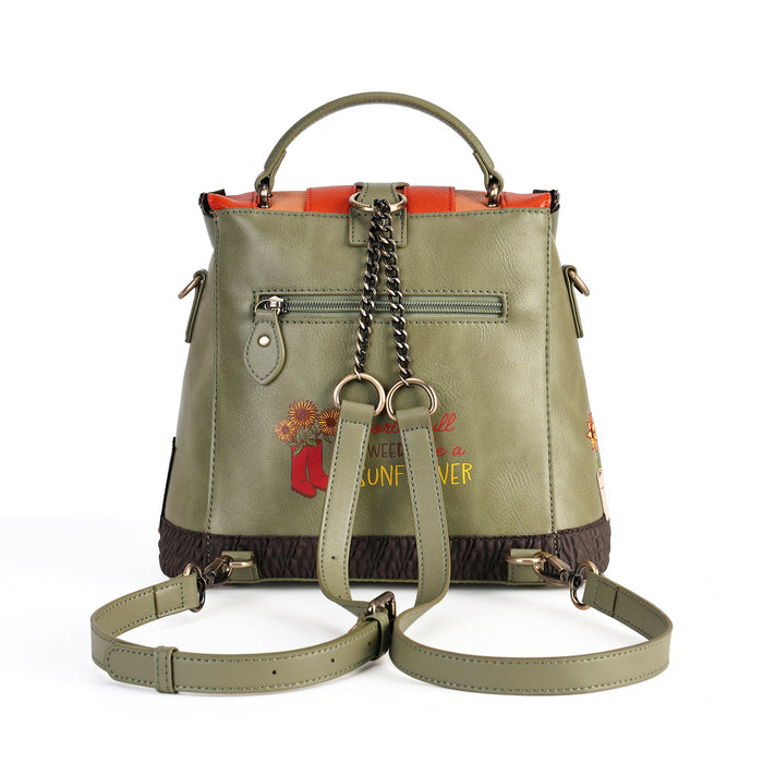 An olive green faux leather handbag with a top handle, detachable shoulder strap, chain strap, and embroidered floral details on the front, set against a plain white background.