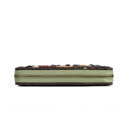 A rectangular zippered pouch or clutch in sage green canvas with dark brown textured trim and a gold-toned zipper, shown against a plain white background.